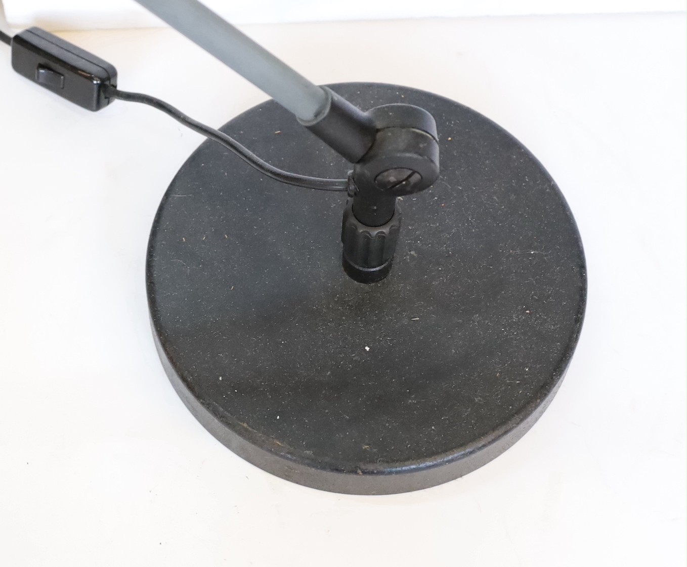 A 1950s Swiss enamelled and painted metal anglepoise lamp, height 56cm to the bend